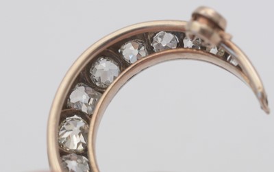 Lot 1 - A diamond crescent brooch.
