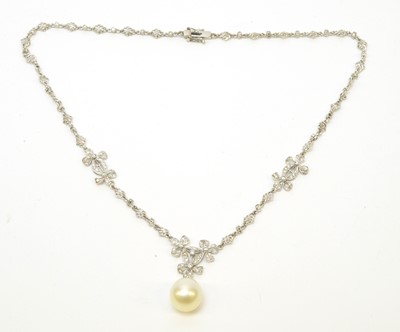 Lot 31 - A diamond necklace with cultured pearl drop.
