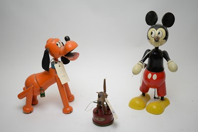 Lot 352 - A pair of painted wooden Walt Disney money...