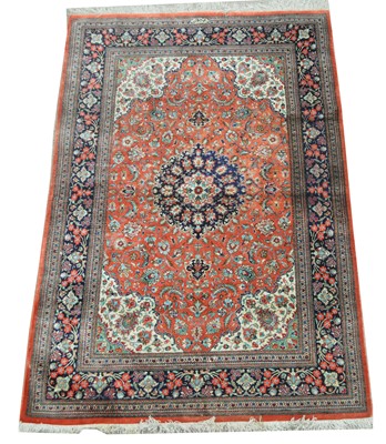 Lot 635 - A modern silk Persian rug.