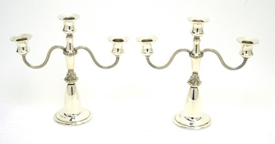 Lot 192 - A pair of silver candelabra