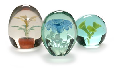 Lot 576 - Three dump paperweights