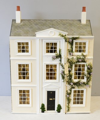 Lot 963 - A three-storey doll's townhouse.