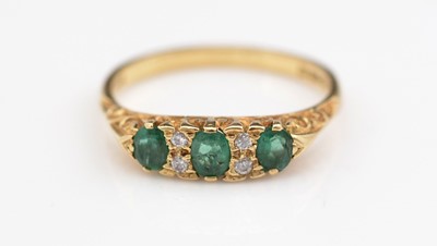 Lot 309 - Emerald and diamond ring.