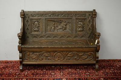 Lot 75 - Early 20th C carved oak settle.