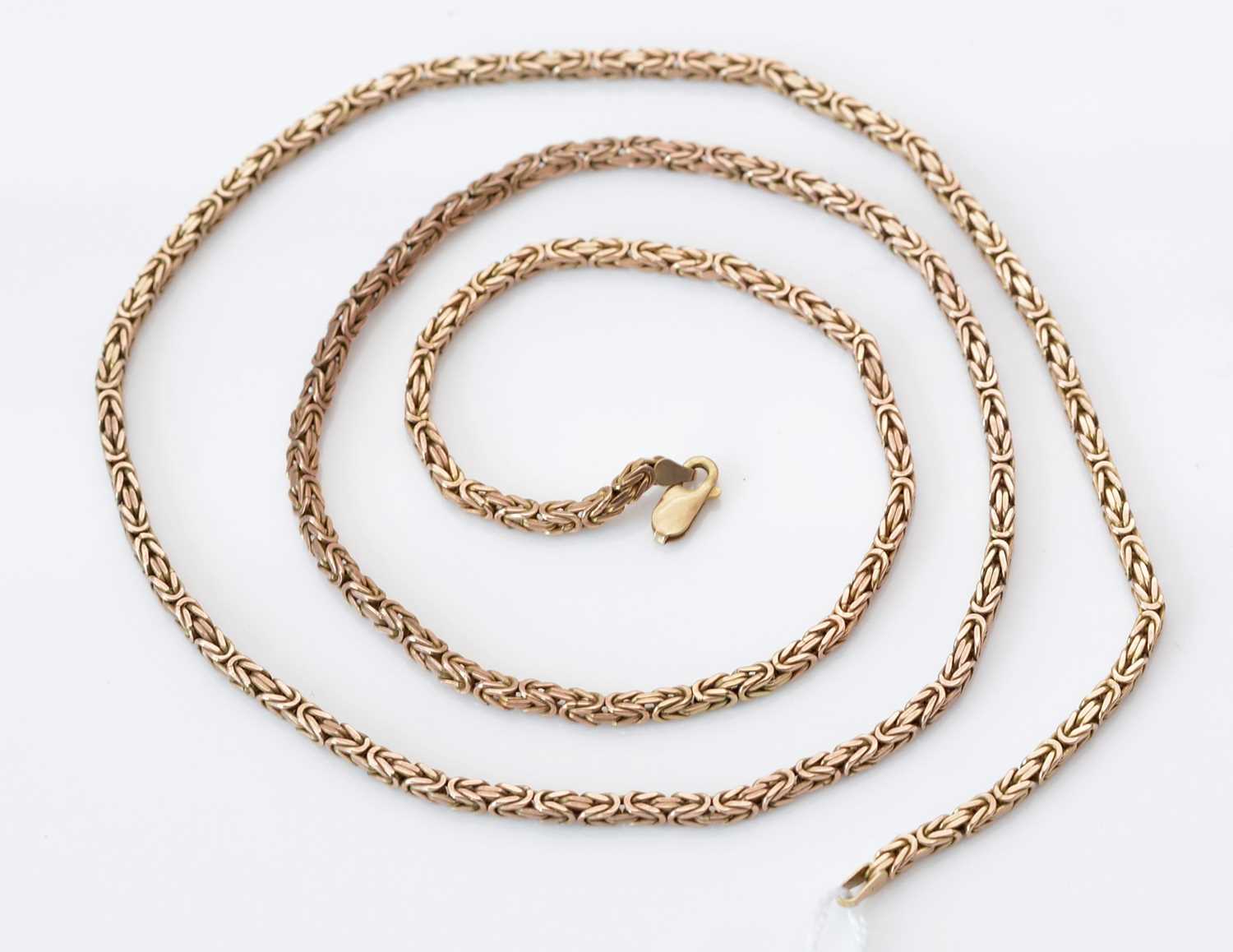 Lot 157 - A 9ct. yellow gold necklace.