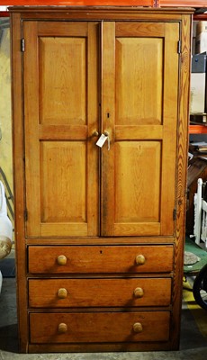 Lot 137 - Early 20th Century pine linen press.