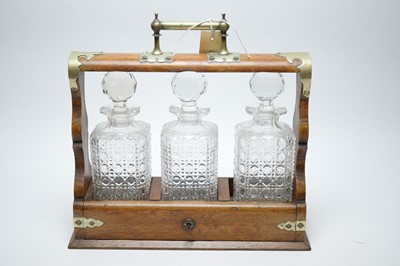 Lot 460 - Early 20th C oak tantalus.