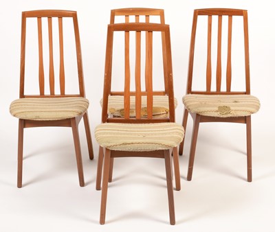 Lot 809 - A mid Century teak extending dining table in the G-Plan style; and four chairs.