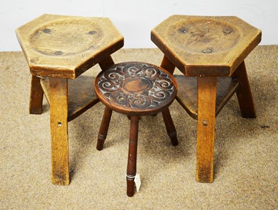 Lot 84 - Two oak milking stools and another stool