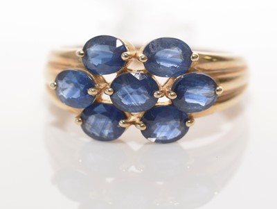 Lot 185 - Seven-stone Kanchanaburi sapphire cluster ring.