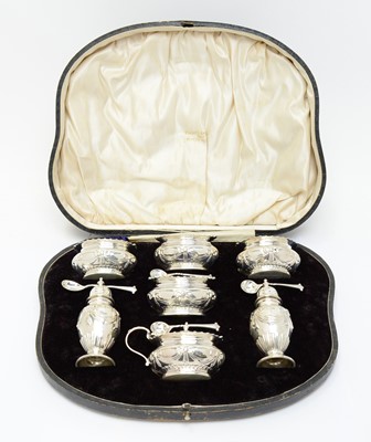 Lot 155 - An Edwardian cased silver cruet set