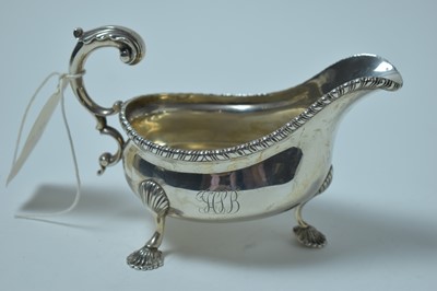 Lot 165 - An Edwardian silver gravy boat.