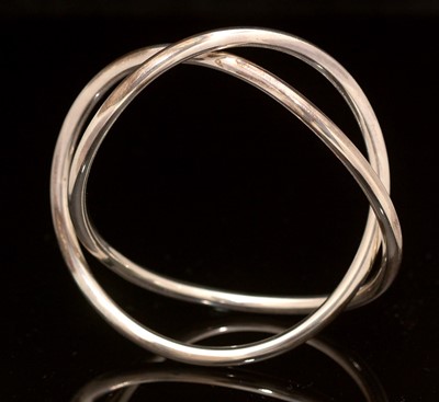 Lot 740 - Hans Hansen for Georg Jensen: sterling silver infinity bangle