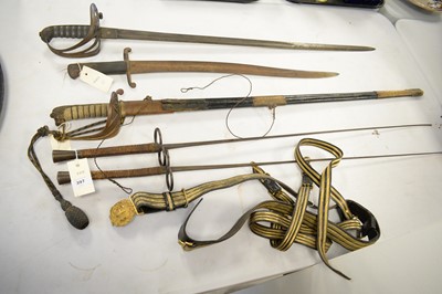 Lot 397 - A collection of militaria including swords.