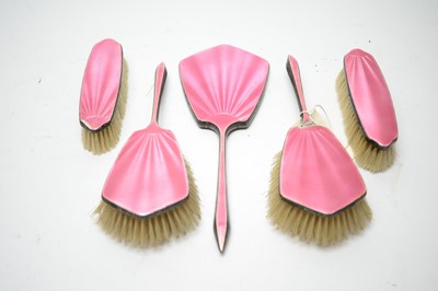 Lot 181 - A pink enamel silver backed dressing table set