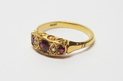 Lot 192 - A garnet and diamond ring.