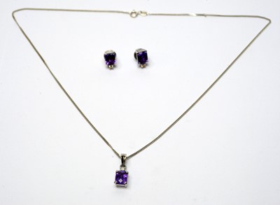 Lot 49 - Amethyst and diamond pendant and earrings
