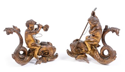 Lot 603 - A pair of ormolu figurines of cherubs riding dolphins.