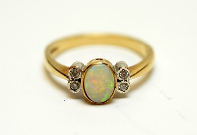 Lot 138 - An opal and diamond ring.