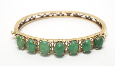 Lot 83 - An aventurine quartz and yellow metal bangle