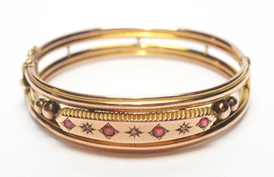 Lot 85 - An Edwardian ruby and diamond bangle