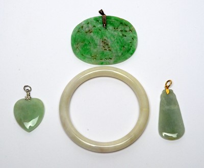Lot 142 - Four items of jade jewellery.