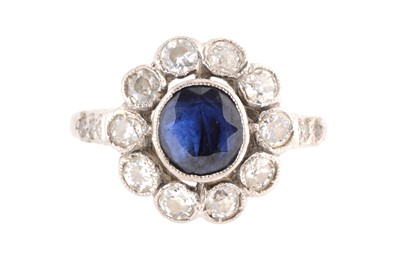 Lot 105 - A sapphire and diamond cluster ring