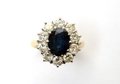 Lot 108 - A sapphire and diamond cluster ring