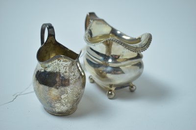 Lot 155 - Two Georgian silver jugs.