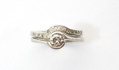 Lot 109 - Diamond engagement ring and wedding band