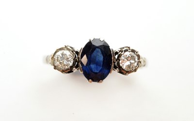Lot 4 - A sapphire and diamond ring