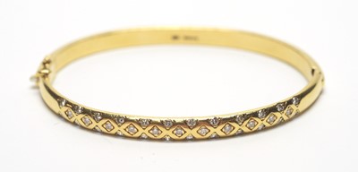 Lot 51 - Diamond set 18ct yellow gold bangle