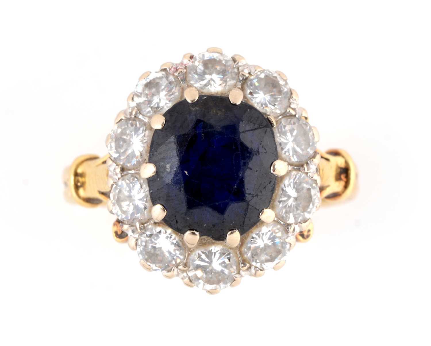 Lot 113 - A sapphire and diamond cluster ring
