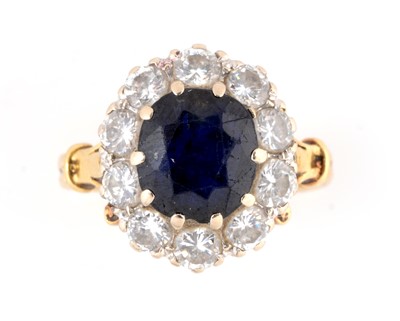 Lot 113 - A sapphire and diamond cluster ring