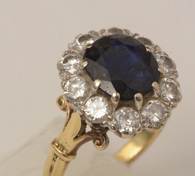 Lot 113 - A sapphire and diamond cluster ring