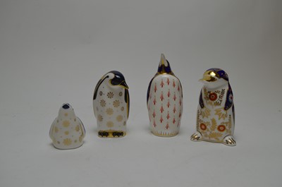 Lot 301 - Three Royal Crown Derby penguin paperweights and another