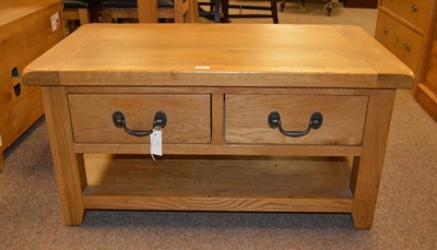 Lot 123 - A group of oak occasional furniture, comprising coffee table, TV cabinet and side table