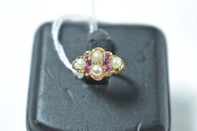 Lot 231 - A late Victorian ruby and half pearl ring