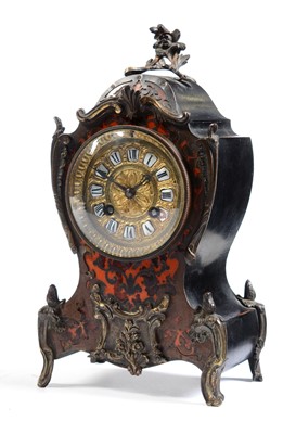 Lot 565 - A 19th Century French Boulle style mantle clock.