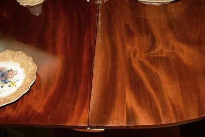 Lot 666 - Early 20th Century mahogany triple pedestal dining table