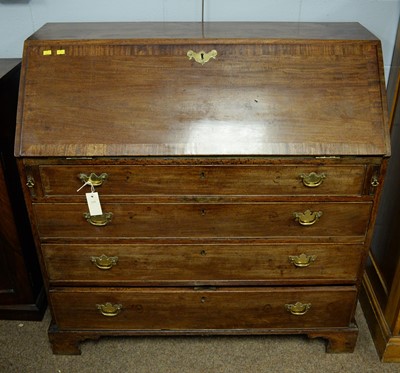 Lot 120 - An early 19th Century mahogany bureau.