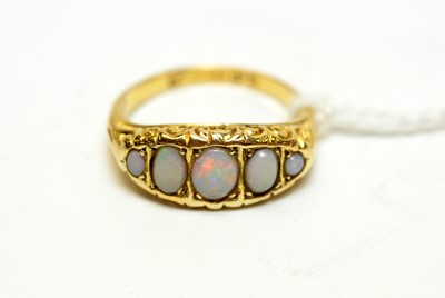Lot 130 - An antique 18ct gold and opal dress ring.