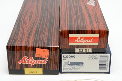 Lot 650 - Three boxed Liliput locomotives and rolling stock.