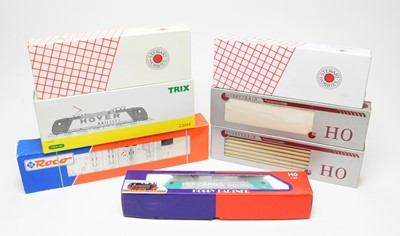 Lot 702 - Boxed HO-gauge model trains.