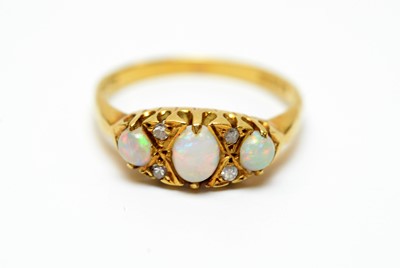 Lot 9 - An 18ct gold, diamond and opal dress ring.