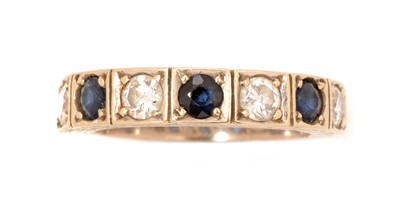Lot 85 - A sapphire and diamond half hoop ring