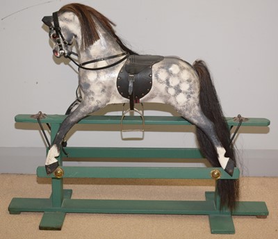 Lot 487 - A 20th Century carved greyed apple rocking horse.