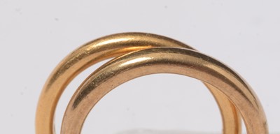 Lot 244 - Two gold and yellow metal wedding bands.