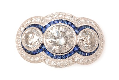 Lot 48 - A diamond and sapphire dress ring